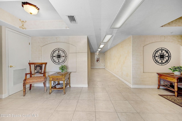 8984 Puerto Del Rio Dr Unit 202, Cape Canaveral, FL 32920 - hall with light tile patterned flooring