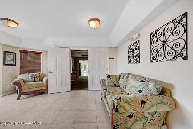 8984 Puerto Del Rio Dr Unit 202, Cape Canaveral, FL 32920 - living area featuring light tile patterned floors