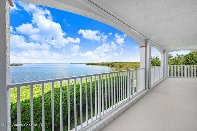 8984 Puerto Del Rio Dr Unit 202, Cape Canaveral, FL 32920 - balcony with a water view
