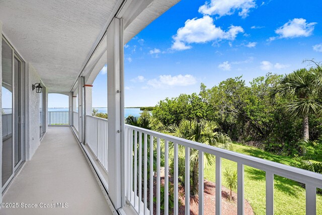 8984 Puerto Del Rio Dr Unit 202, Cape Canaveral, FL 32920 - balcony with a water view