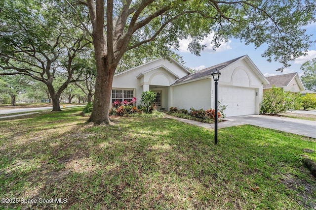 3046 Sebastian Ln, Melbourne, FL 32935 - ranch-style house with stucco siding, a garage, concrete driveway, and a front lawn