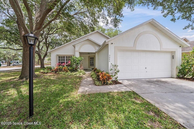 3046 Sebastian Ln, Melbourne, FL 32935 - ranch-style house featuring stucco siding, an attached garage, driveway, and a front lawn