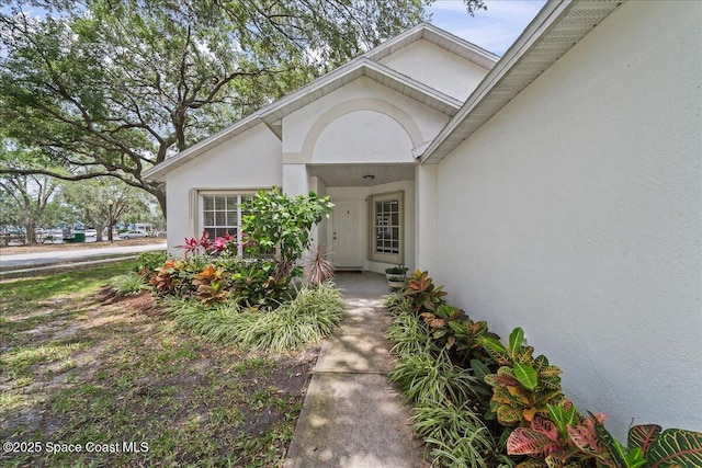 3046 Sebastian Ln, Melbourne, FL 32935 - doorway to property featuring stucco siding