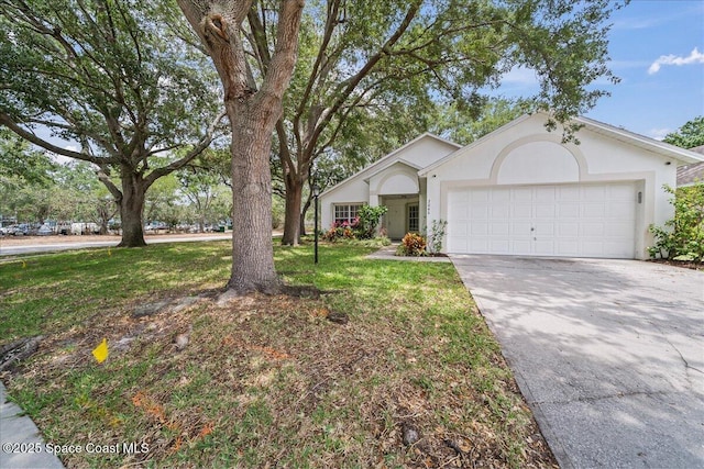 3046 Sebastian Ln, Melbourne, FL 32935 - ranch-style home with a garage, stucco siding, concrete driveway, and a front yard