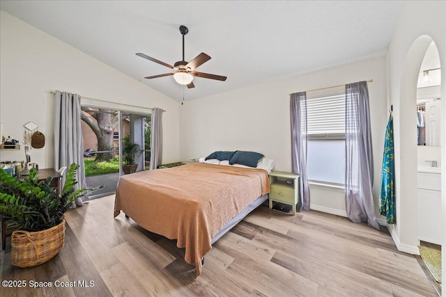 3046 Sebastian Ln, Melbourne, FL 32935 - bedroom featuring access to exterior, light wood-type flooring, vaulted ceiling, a ceiling fan, and baseboards
