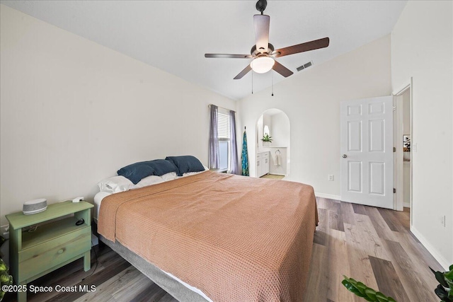 3046 Sebastian Ln, Melbourne, FL 32935 - bedroom featuring vaulted ceiling, wood finished floors, baseboards, and a ceiling fan