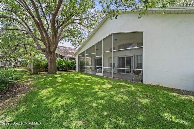 3046 Sebastian Ln, Melbourne, FL 32935 - view of green lawn with a sunroom