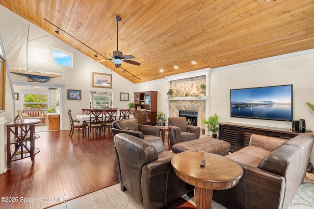 420 Tortoise View Cir, Satellite Beach, FL 32937 - living area featuring wood ceiling, high vaulted ceiling, a large fireplace, and ceiling fan