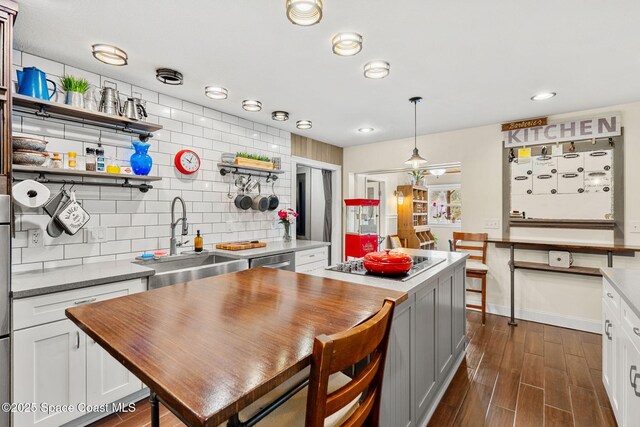 420 Tortoise View Cir, Satellite Beach, FL 32937 - kitchen with electric cooktop, a sink, butcher block counters, open shelves, and recessed lighting