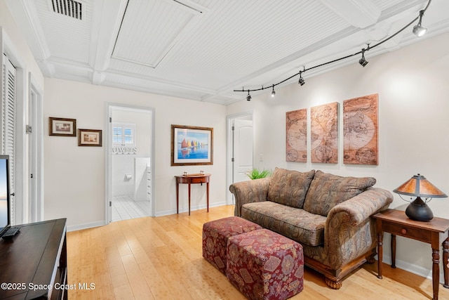 420 Tortoise View Cir, Satellite Beach, FL 32937 - living room with track lighting, wood finished floors, and baseboards