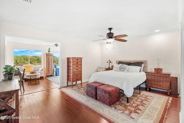 420 Tortoise View Cir, Satellite Beach, FL 32937 - bedroom with ornamental molding, access to outside, hardwood / wood-style flooring, ceiling fan, and baseboards