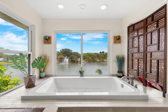 420 Tortoise View Cir, Satellite Beach, FL 32937 - full bath featuring a jetted tub, healthy amount of natural light, a water view, and recessed lighting