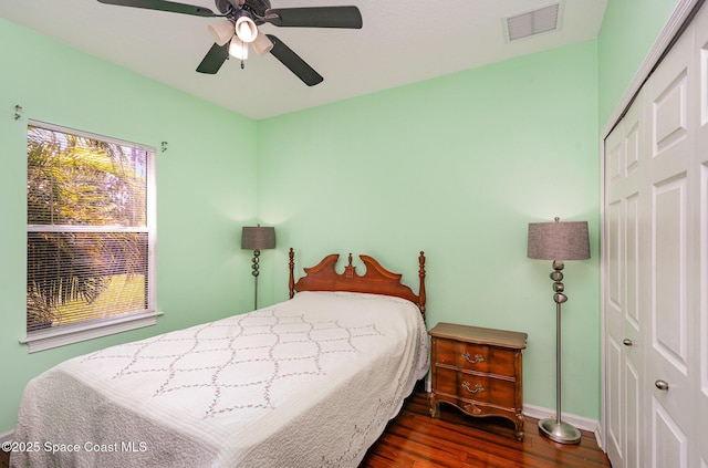 2871 Fontainebleau Ave SE, Palm Bay, FL 32909 - bedroom with wood finished floors, a closet, baseboards, and a ceiling fan