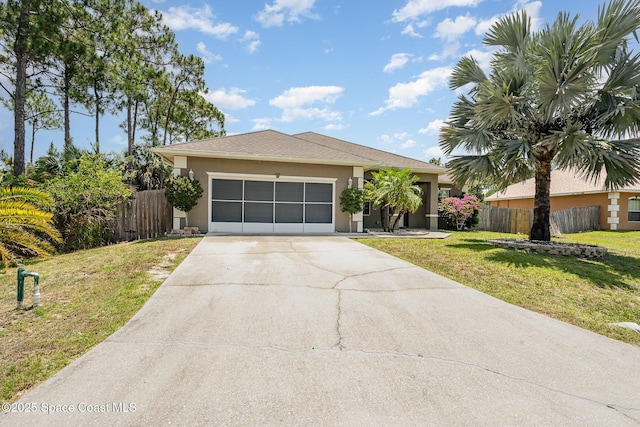 2871 Fontainebleau Ave SE, Palm Bay, FL 32909 - view of front of property with driveway, stucco siding, and an attached garage