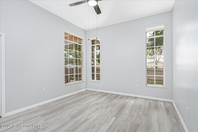 2508 Coral Ridge Cir, Melbourne, FL 32935 - spare room with a ceiling fan, wood finished floors, and baseboards
