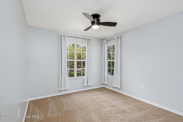 2508 Coral Ridge Cir, Melbourne, FL 32935 - carpeted empty room with a ceiling fan and baseboards