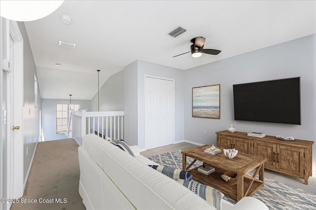 2508 Coral Ridge Cir, Melbourne, FL 32935 - living area featuring baseboards, ceiling fan, and light carpet