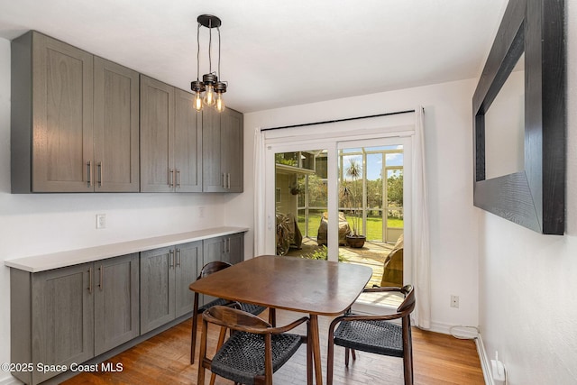 118 S Indian Cir, Cocoa, FL 32922 - dining area featuring light wood-type flooring and baseboards