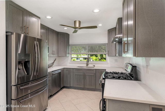 118 S Indian Cir, Cocoa, FL 32922 - kitchen with appliances with stainless steel finishes, a sink, ceiling fan, light countertops, and recessed lighting