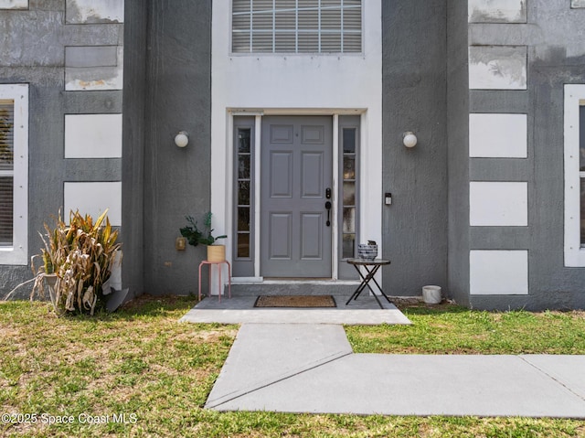 1889 Nanton St NW, Palm Bay, FL 32907 - property entrance featuring stucco siding and a yard