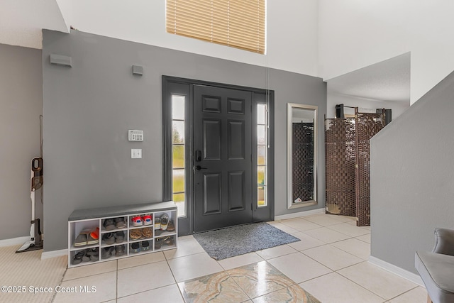 1889 Nanton St NW, Palm Bay, FL 32907 - tiled entrance foyer featuring baseboards and a towering ceiling