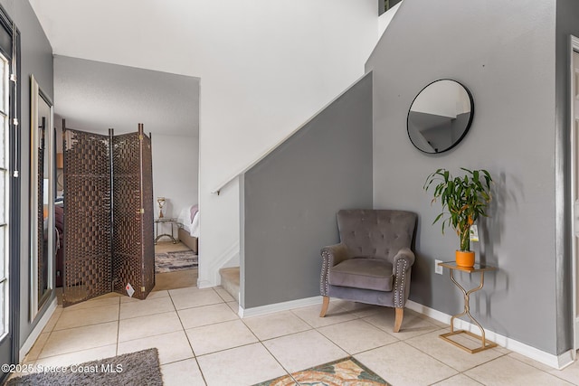 1889 Nanton St NW, Palm Bay, FL 32907 - living area with tile patterned floors, stairway, and baseboards