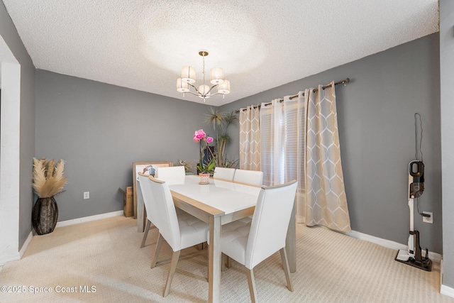 1889 Nanton St NW, Palm Bay, FL 32907 - carpeted dining area with a chandelier, baseboards, and a textured ceiling