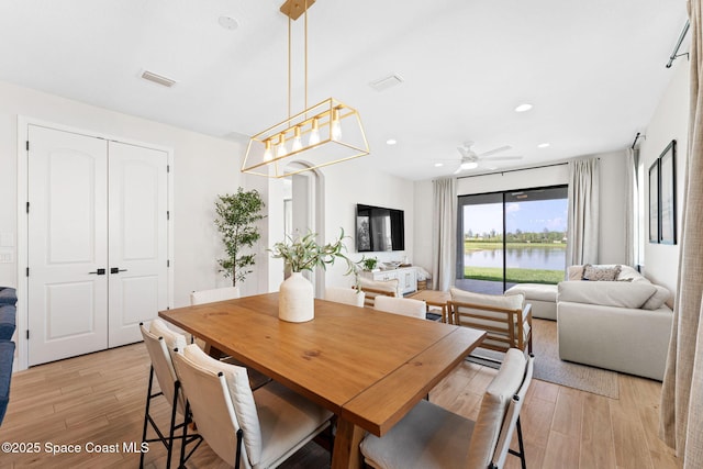 3015 Blazing Star Dr, Melbourne, FL 32940 - dining room featuring light wood finished floors, a ceiling fan, and recessed lighting