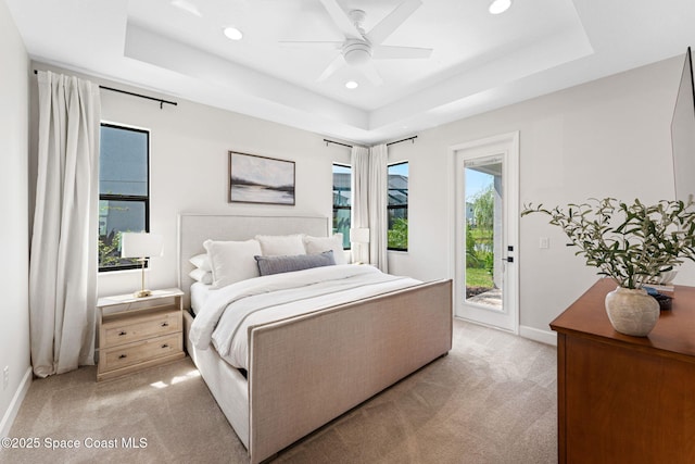 3015 Blazing Star Dr, Melbourne, FL 32940 - bedroom featuring light colored carpet, a raised ceiling, access to exterior, recessed lighting, and baseboards