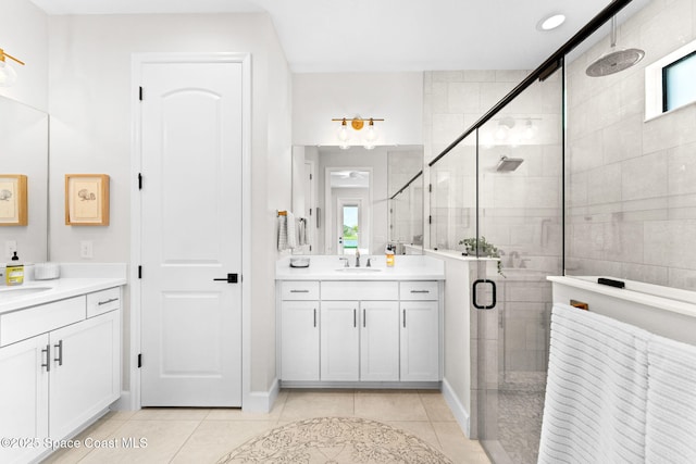 3015 Blazing Star Dr, Melbourne, FL 32940 - bathroom with a stall shower, two vanities, and tile patterned floors