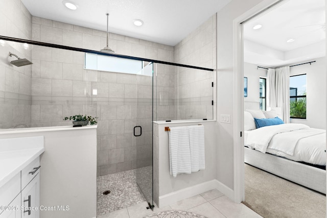 3015 Blazing Star Dr, Melbourne, FL 32940 - bathroom featuring connected bathroom, a shower stall, recessed lighting, tile patterned flooring, and vanity