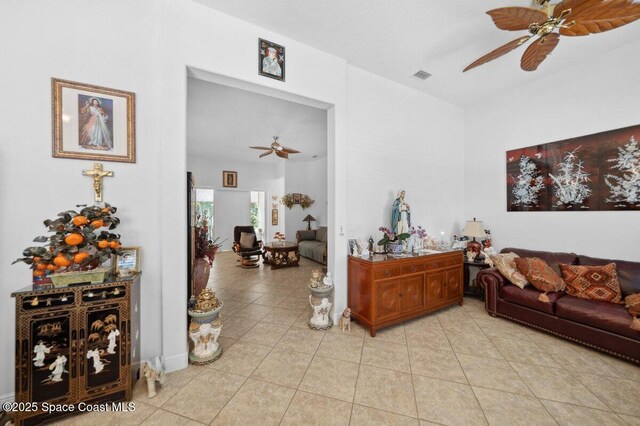 3385 Soft Breeze Cir, Melbourne, FL 32904 - living area featuring ceiling fan and light tile patterned floors