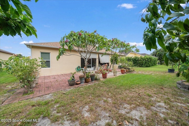 3385 Soft Breeze Cir, Melbourne, FL 32904 - view of grassy yard with a patio
