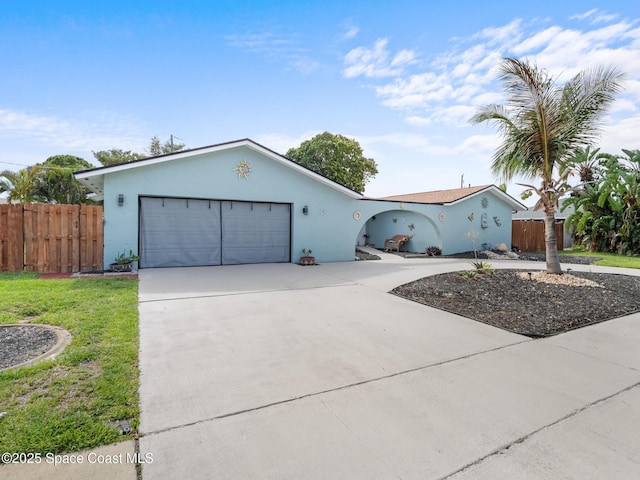1475 Mars St, Merritt Island, FL 32953 - ranch-style home featuring driveway, stucco siding, and an attached garage