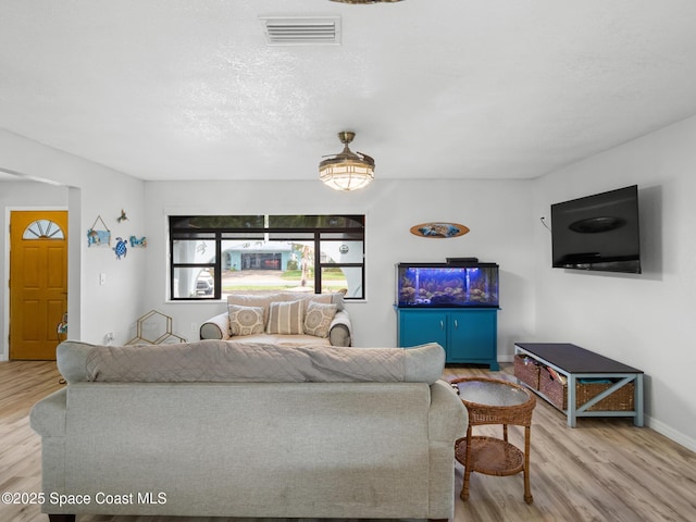 1475 Mars St, Merritt Island, FL 32953 - living room featuring wood finished floors and baseboards