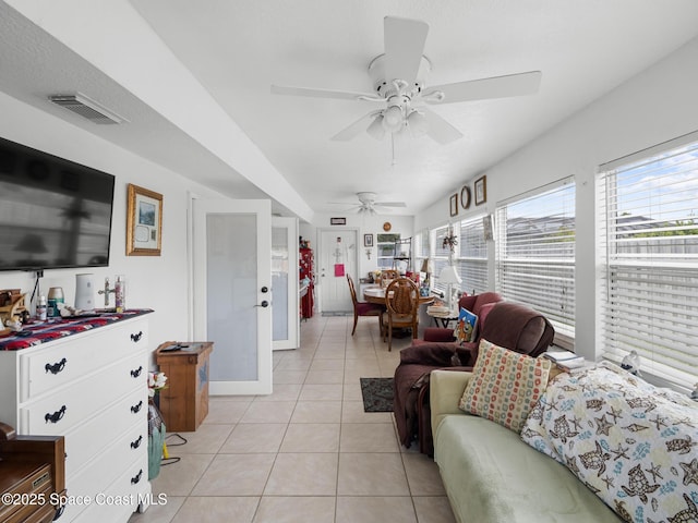 1475 Mars St, Merritt Island, FL 32953 - living room with light tile patterned floors, ceiling fan, and french doors