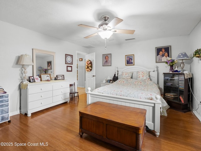 1475 Mars St, Merritt Island, FL 32953 - bedroom featuring wood finished floors, a ceiling fan, and baseboards