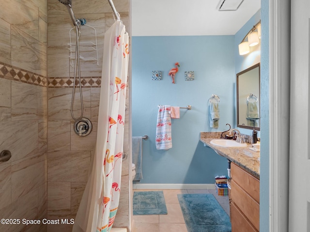 1475 Mars St, Merritt Island, FL 32953 - bathroom featuring tile patterned floors, vanity, tiled shower, and baseboards