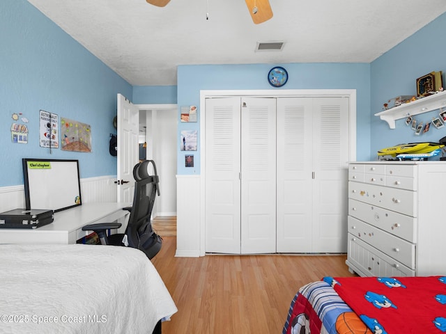 1475 Mars St, Merritt Island, FL 32953 - bedroom featuring light wood finished floors, a closet, and a ceiling fan
