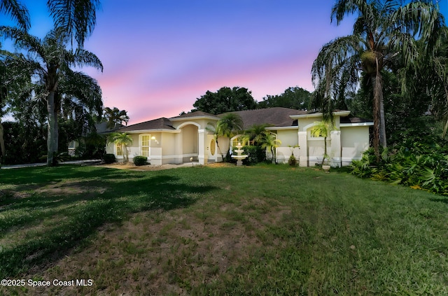 6858 Sweet Bay Ct, Cocoa, FL 32927 - view of front of house with stucco siding and a front lawn