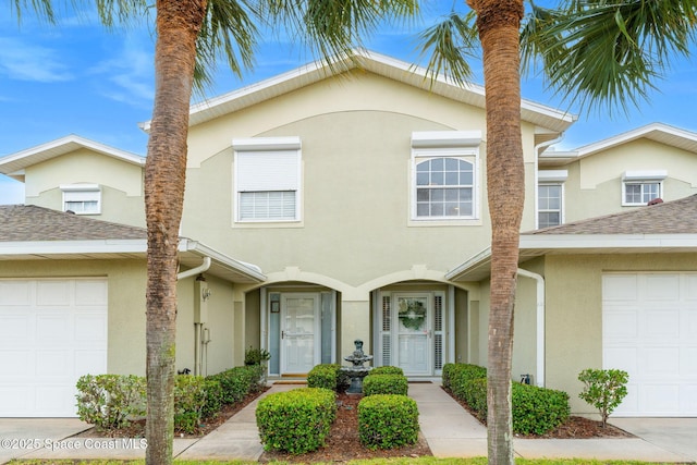262 Prince William Ct, Satellite Beach, FL 32937 - townhome / multi-family property featuring stucco siding and an attached garage