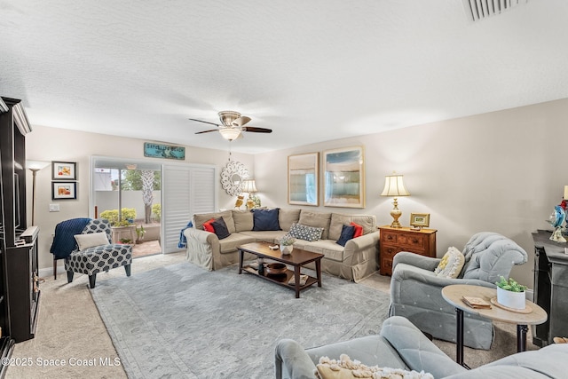 262 Prince William Ct, Satellite Beach, FL 32937 - living area with light colored carpet and ceiling fan