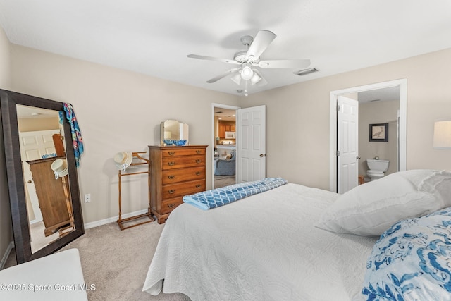 262 Prince William Ct, Satellite Beach, FL 32937 - bedroom with light colored carpet, a ceiling fan, and ensuite bath