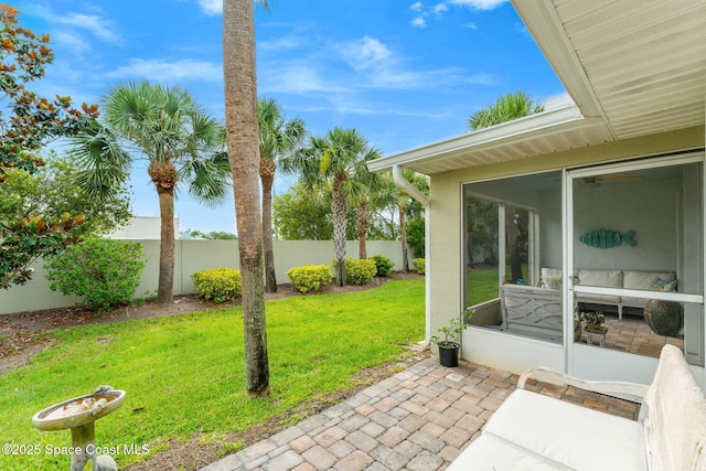 262 Prince William Ct, Satellite Beach, FL 32937 - fenced backyard featuring a sunroom