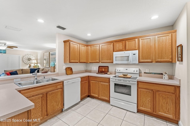 262 Prince William Ct, Satellite Beach, FL 32937 - kitchen featuring white appliances, light tile patterned floors, light countertops, open floor plan, and recessed lighting
