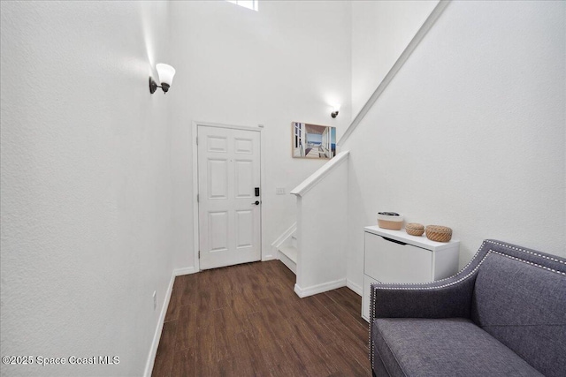 2500 Revolution St Unit 103, Melbourne, FL 32935 - foyer entrance featuring wood finished floors, baseboards, and stairs