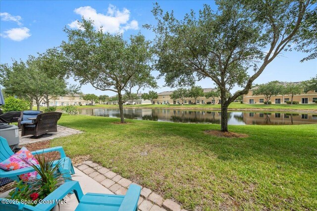 2500 Revolution St Unit 103, Melbourne, FL 32935 - view of grassy yard featuring a water view and a residential view