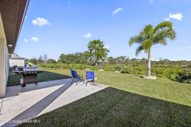 4554 Magenta Isles Dr, Melbourne, FL 32904 - view of green lawn with a patio area