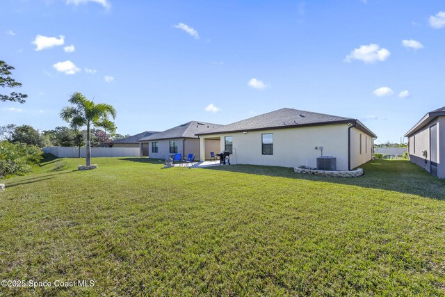 4554 Magenta Isles Dr, Melbourne, FL 32904 - back of property featuring central AC unit, a patio area, and stucco siding