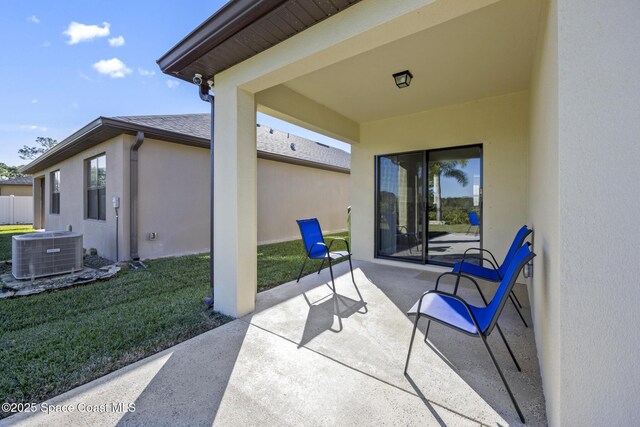 4554 Magenta Isles Dr, Melbourne, FL 32904 - view of patio featuring central AC